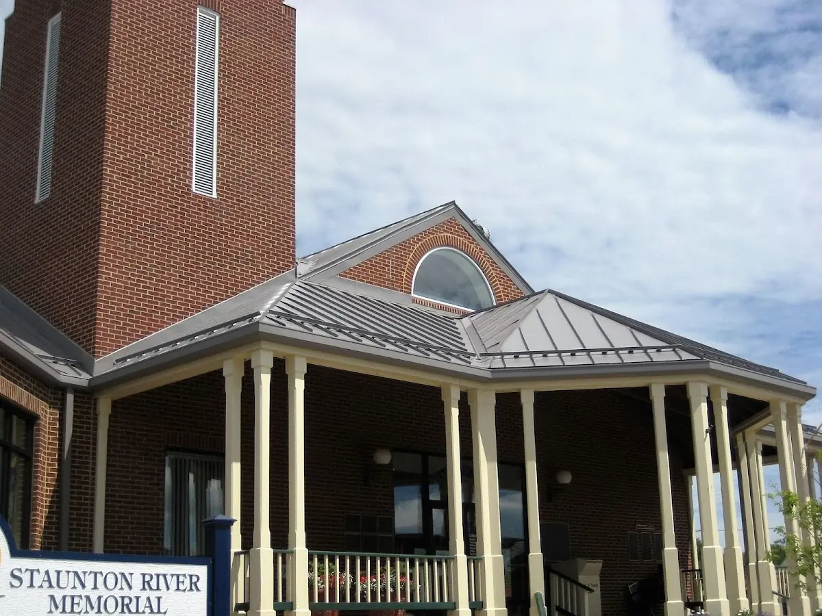 Skilled roofing craftsmen working on a residential roof in Talcottville